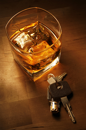 glass of whiskey and keys